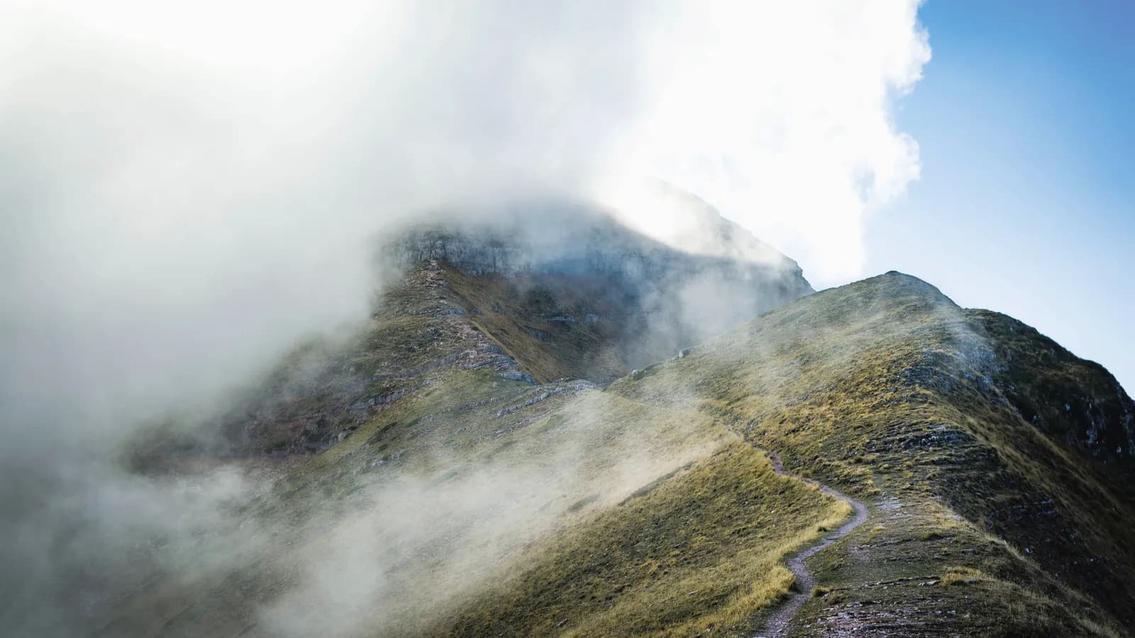 A summit ridge half buried in cloud.